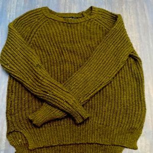 *this sweater has a few stains, one on the arm and another on the torso part*